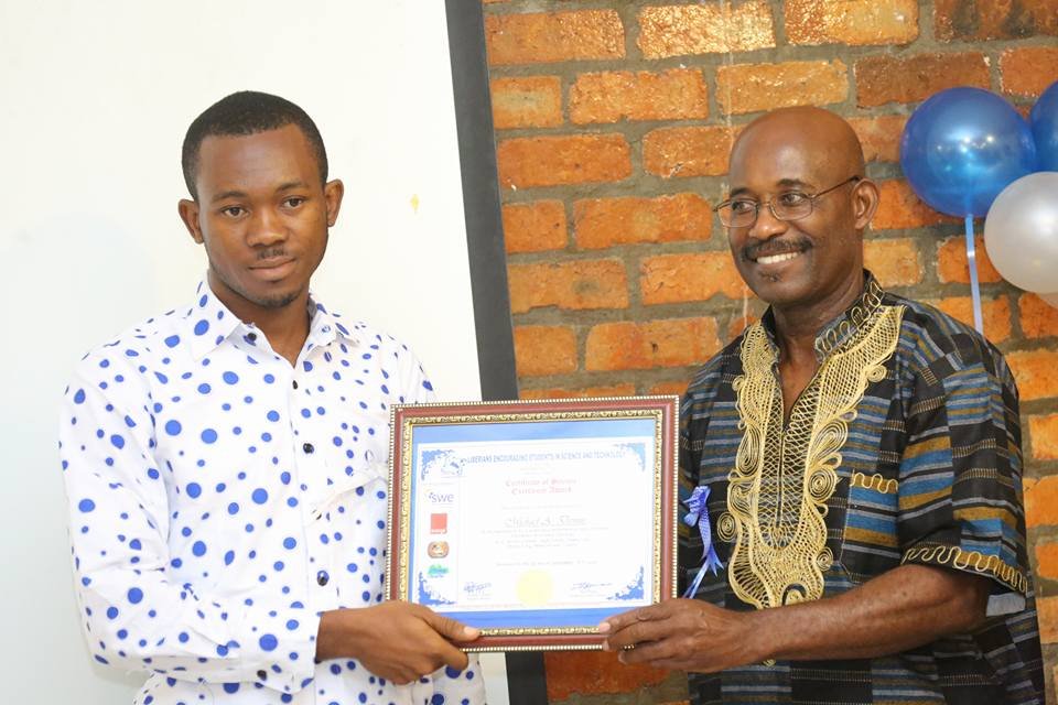 Dr. Dennis presenting Award to Chemistry Teacher
