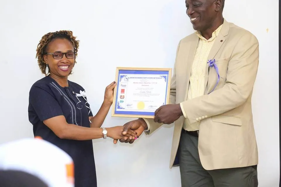Cecilia-G-Davis-recieving-her-Award-happily (1)